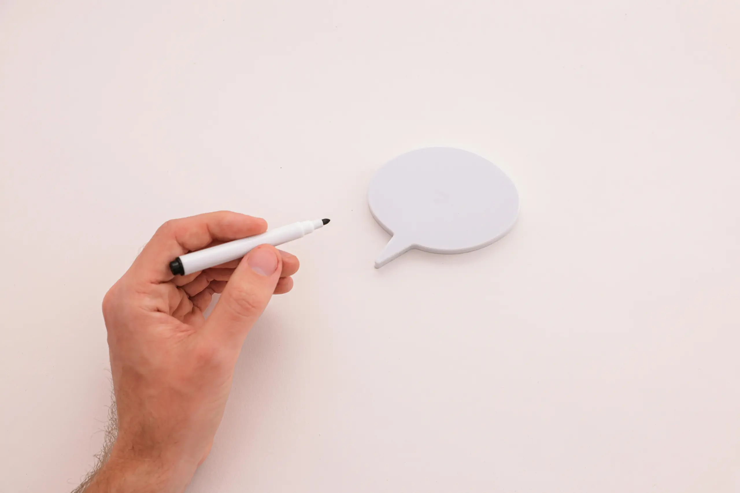 Sprechblase und Stift