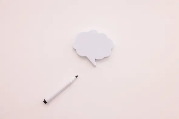 Zu sehen ist eine Gedankenblase mit einem Stift