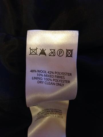 Zettel der nicht waschbaren Jacke - (Jacke, Waschmaschine, waschen)