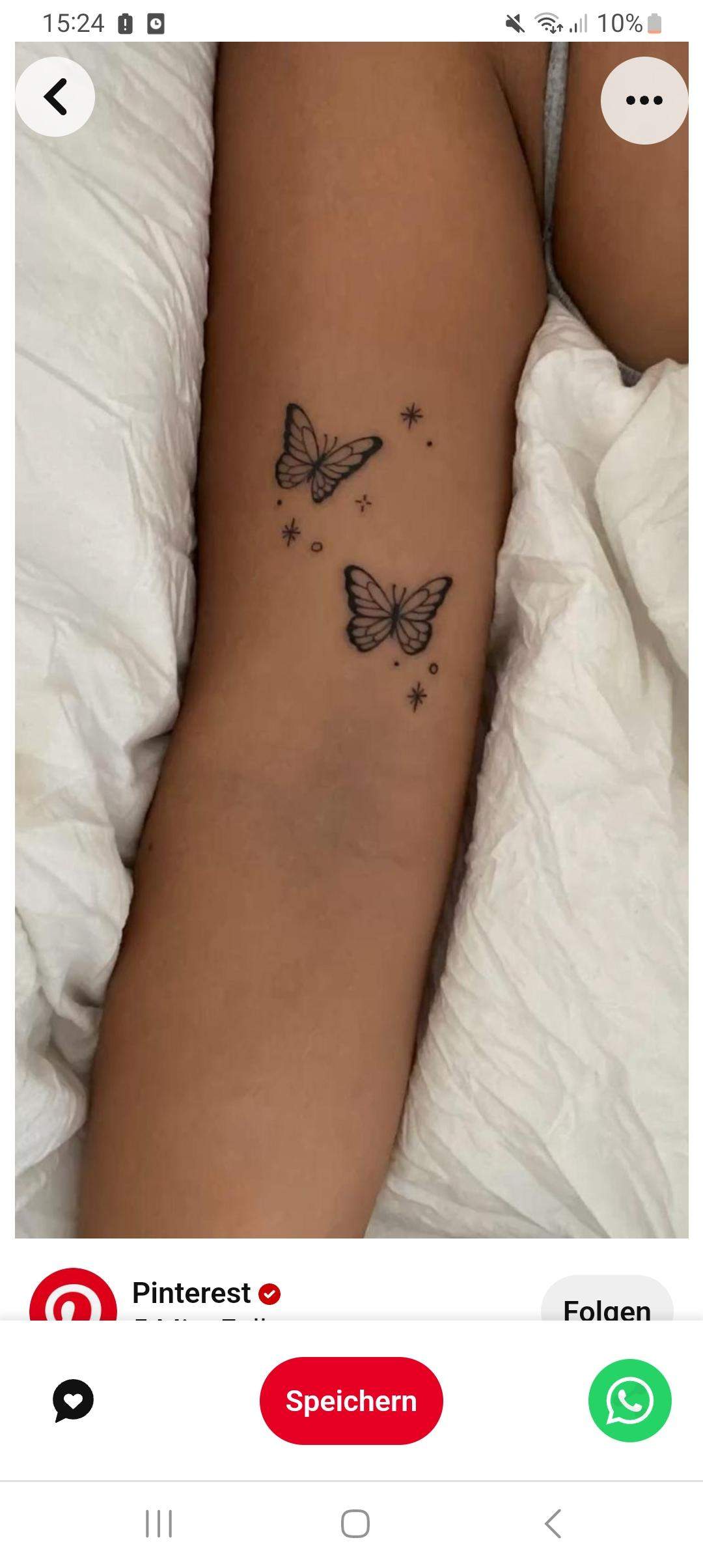 Tattoo Arm Frau Schmetterling
